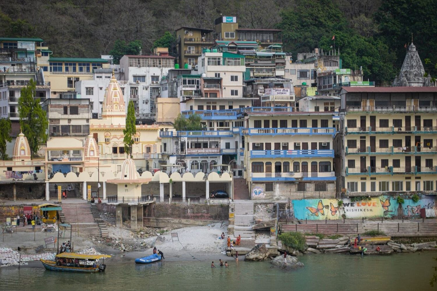 Houses, guesthouses and temples stacked along the Ganges at Rishikesh
